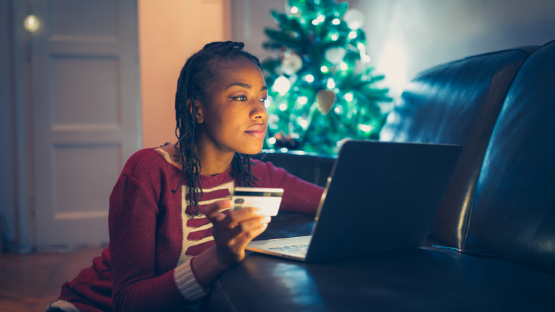 Woman shopping for Christmas gifts online