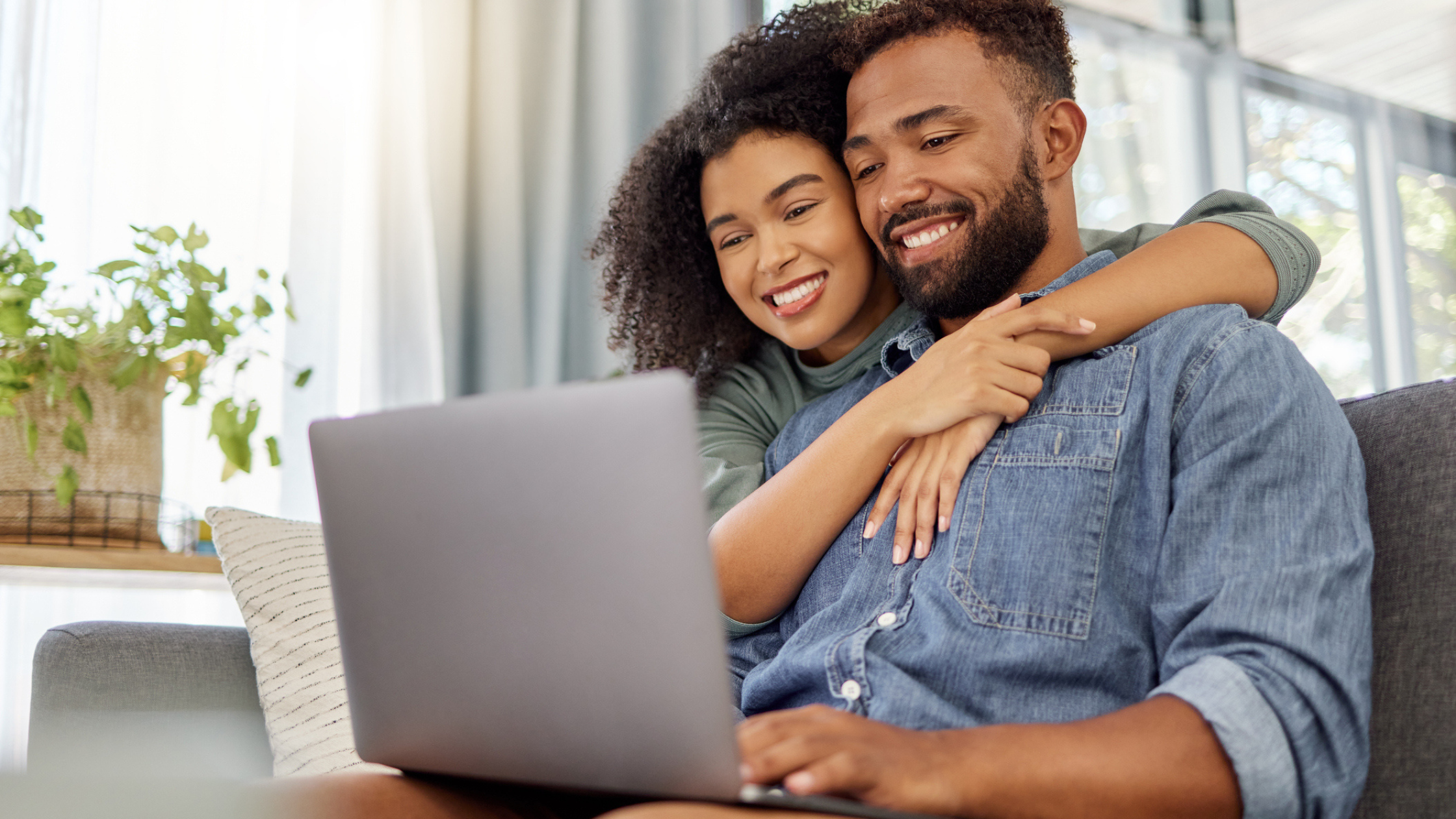 Young couple looking at laptop
