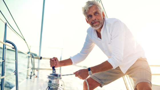 Senior man on sail boat