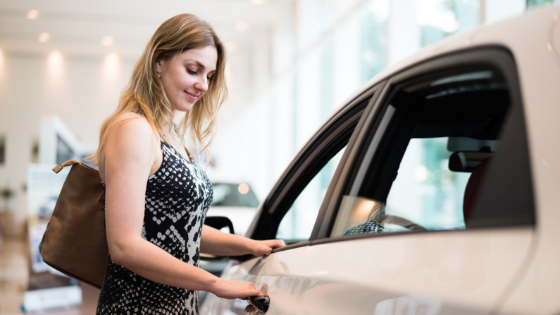 Woman looking at car